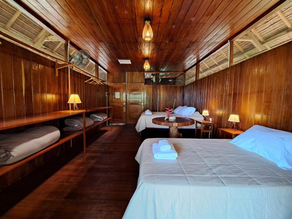 Postel nebo postele na pokoji v ubytování Andean Wings Sotupa Eco Lodge
