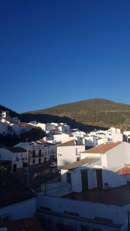 a group of white buildings with a blue sky at Casa Lavanderas in Algodonales