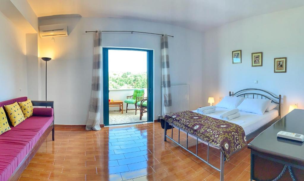 Postel nebo postele na pokoji v ubytování Evaggelias Home Gavalochori