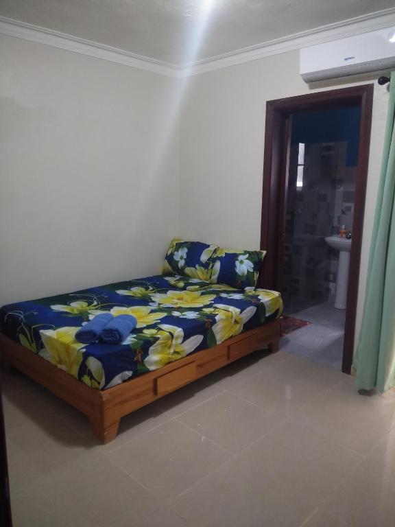 Postel nebo postele na pokoji v ubytování M & L Shared Apartment