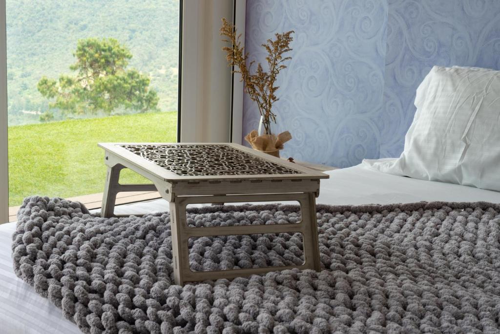 Postel nebo postele na pokoji v ubytování Sukha Resort