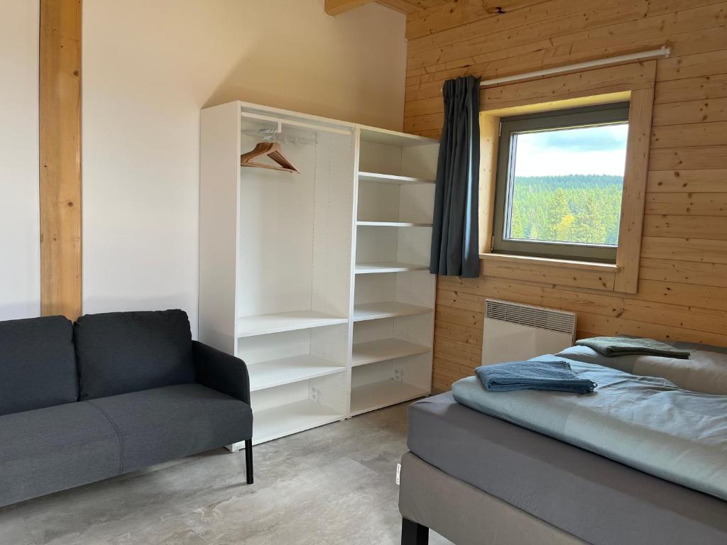 Postel nebo postele na pokoji v ubytování Roubenky Hřebečná