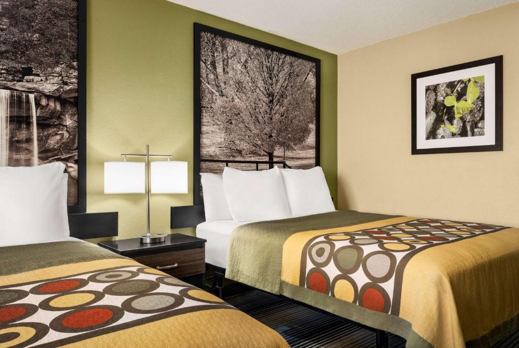 a hotel room with two beds and a window at Super 8 by Wyndham Maysville KY in Maysville