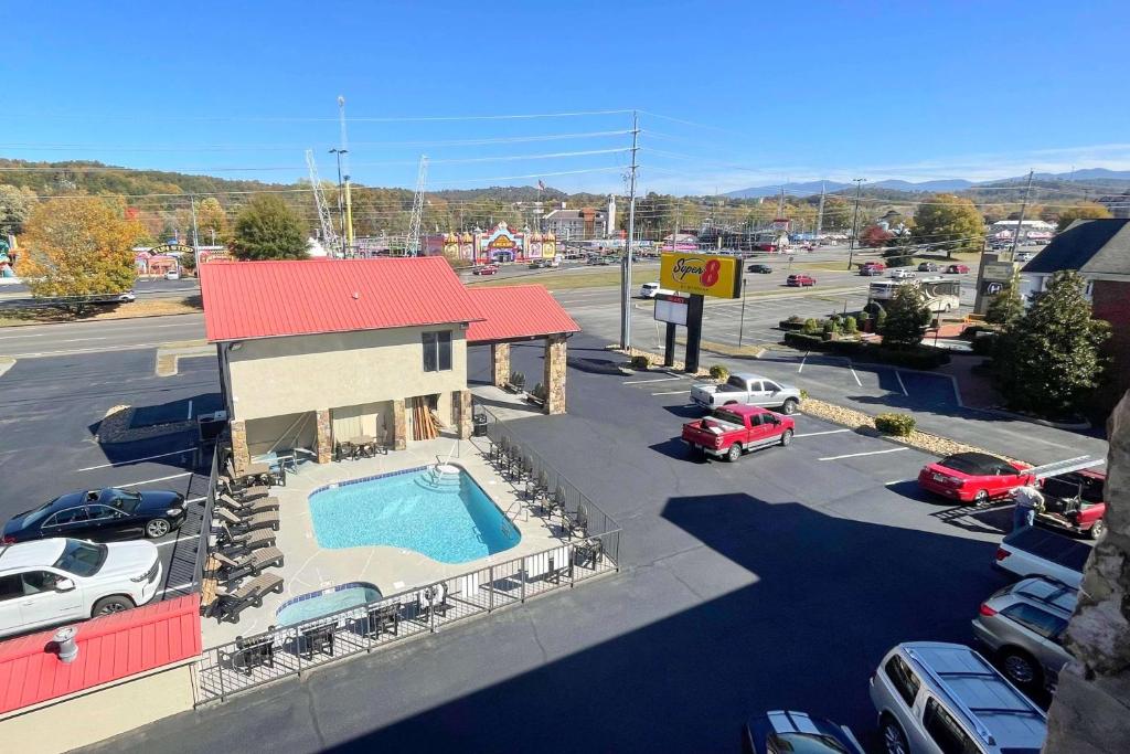 an overhead view of a parking lot with a pool at Super 8 by Wyndham Pigeon Forge Downtown in Pigeon Forge