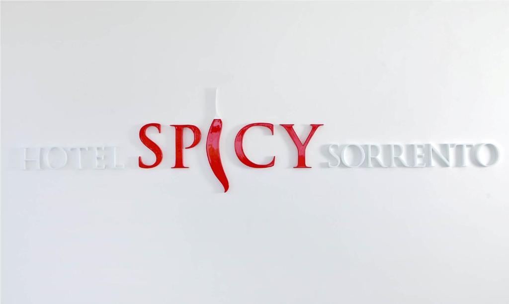 a close up of the word spicy and the texterno at Hotel Spicy in Sorrento