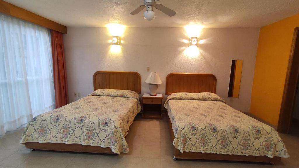 Postel nebo postele na pokoji v ubytování Hotel La Rinconada Tequisquiapan