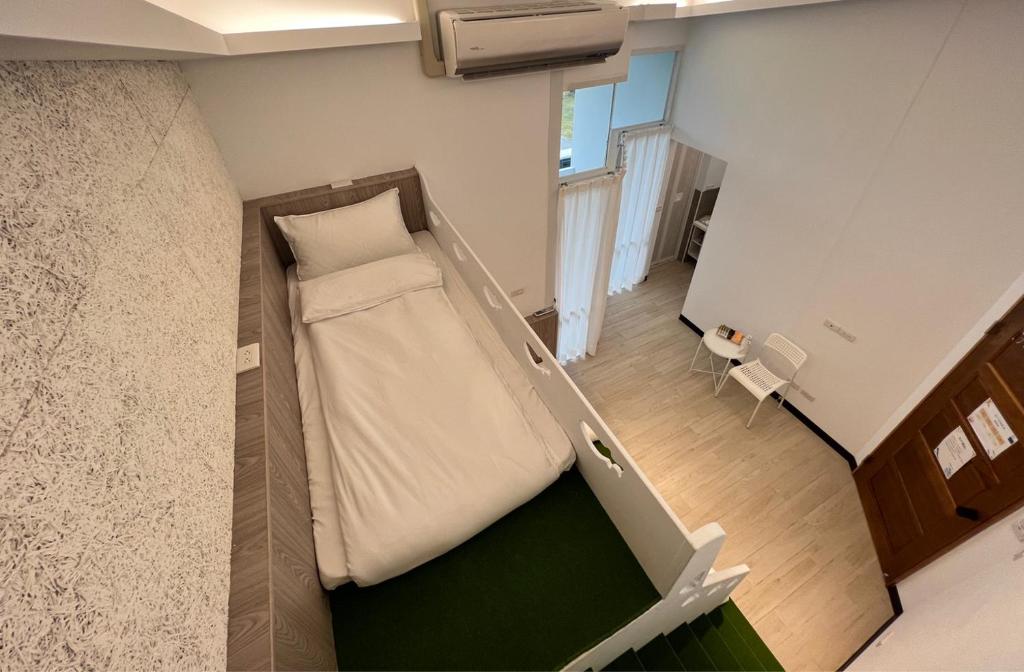 Postel nebo postele na pokoji v ubytování 高一 33 班 Homestay 1982