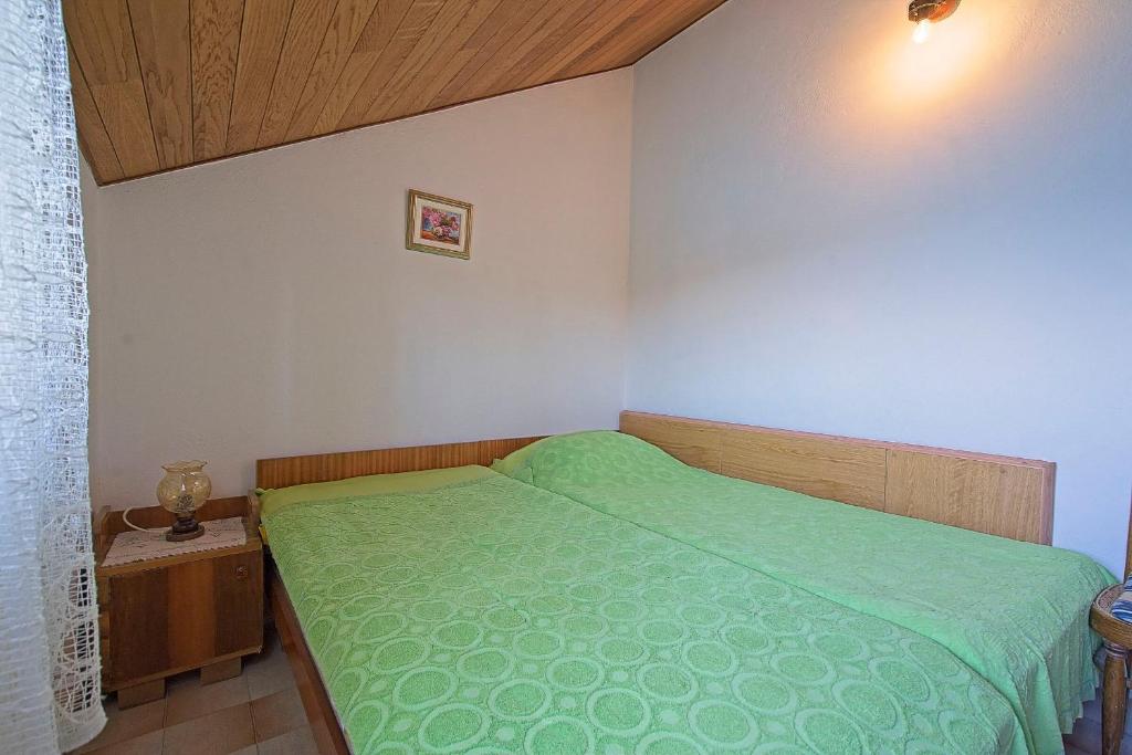 Postel nebo postele na pokoji v ubytování Apartments Lucija