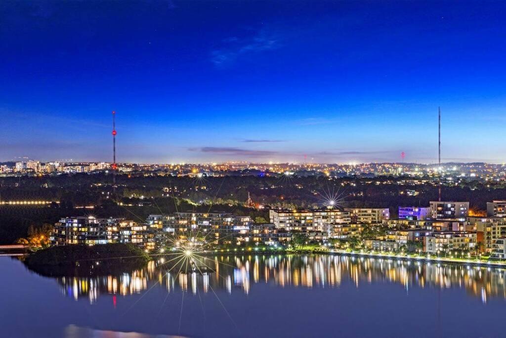 a view of a city at night at New Luxury stunning water view 2bed2bath Condo in Sydney