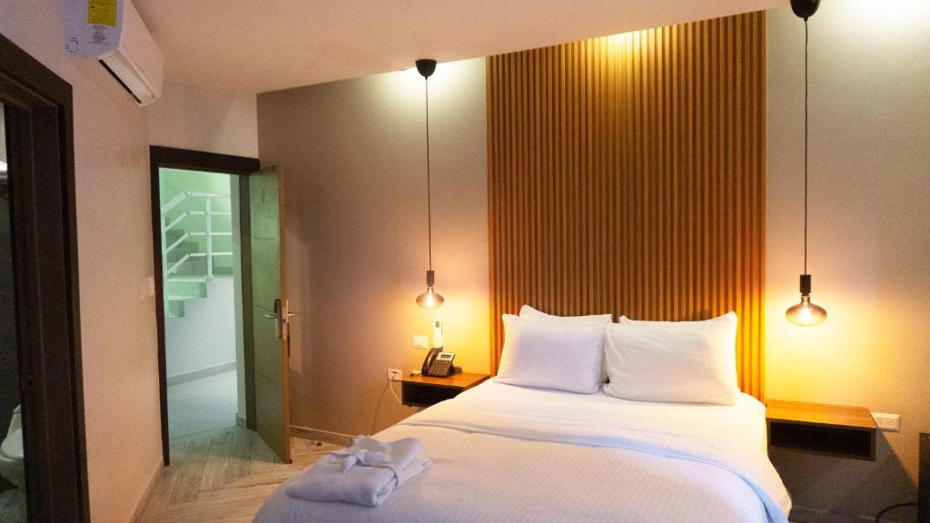 Postel nebo postele na pokoji v ubytování HOTEL ALKQUIMIA
