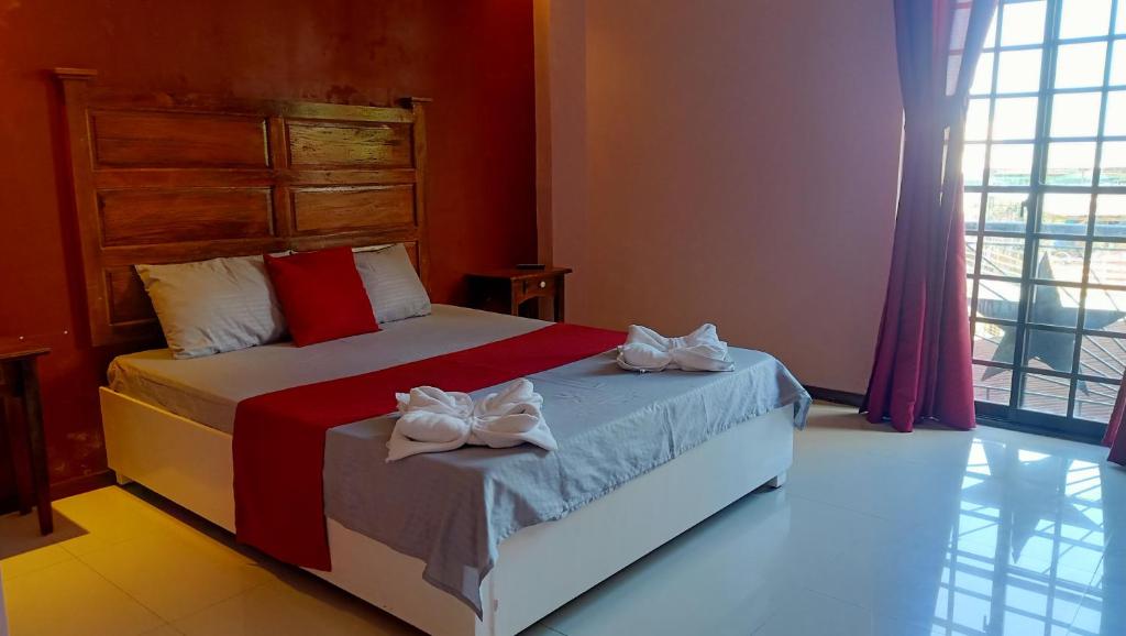 Postel nebo postele na pokoji v ubytování Answer hotel