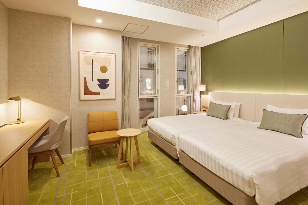 Postel nebo postele na pokoji v ubytování Kichijoji Excel Hotel Tokyu