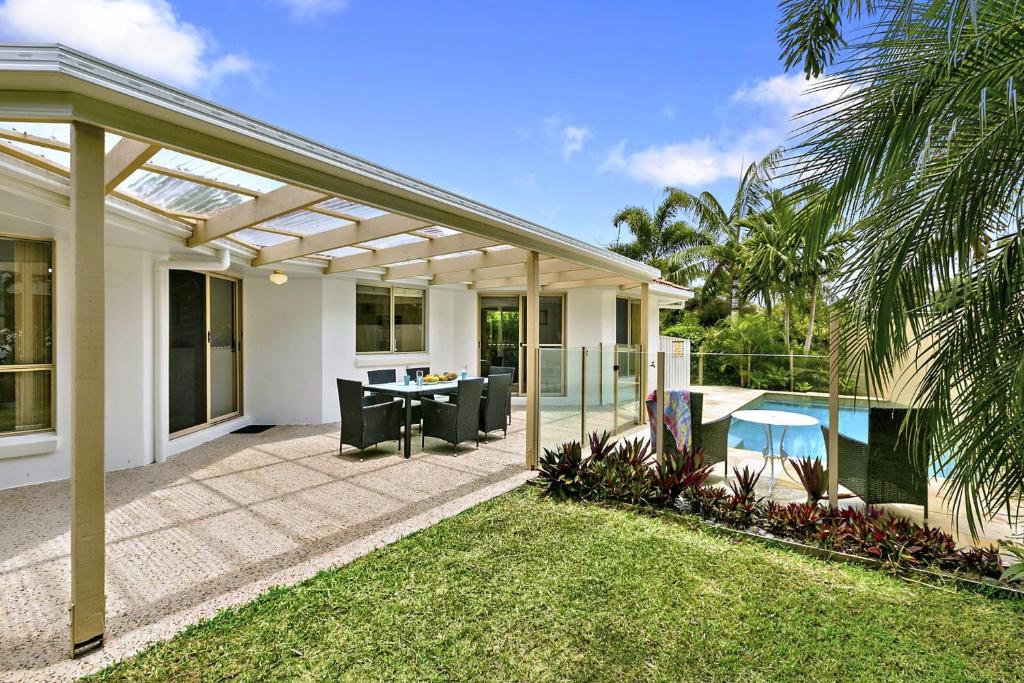 a patio of a home with a pergola at 21 David Street Noosa Heads in Noosa Heads