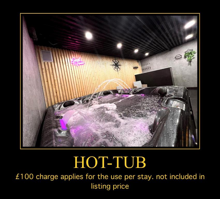 a hot tub in a room with at Penthouse Style Luxury 2 Bedroom House has Hot-Tub, extra fees apply in Birmingham
