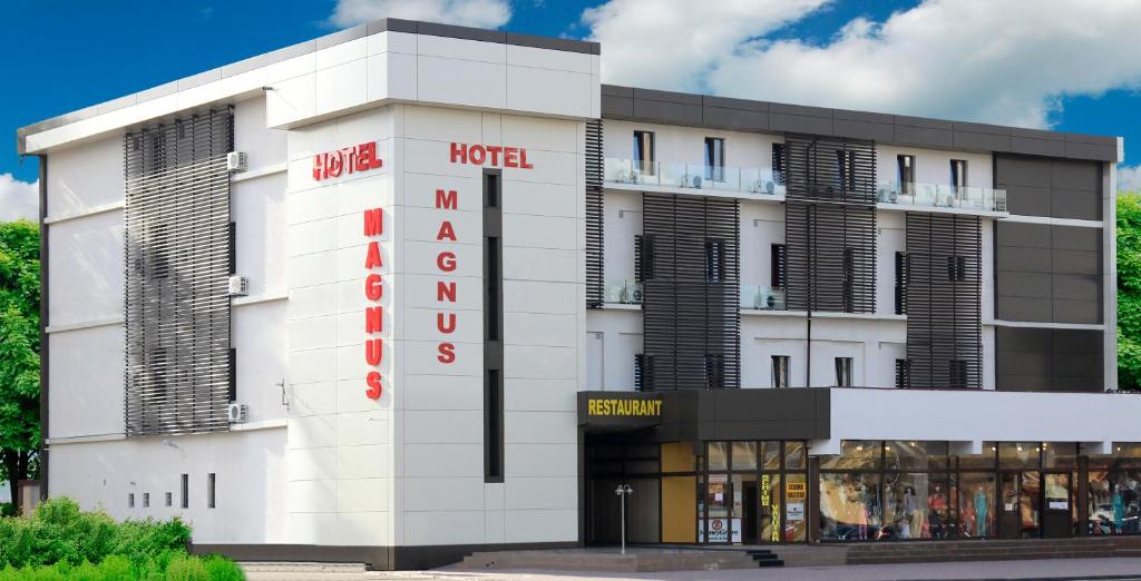 a hotel with a sign on the front of it at Hotel Magnus Galati in Galaţi