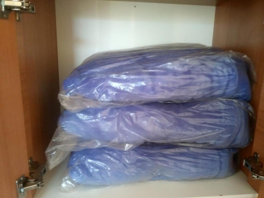 a stack of plastic bags in a room at diRoma Fiori 89 com roupa de cama e banho. in Caldas Novas