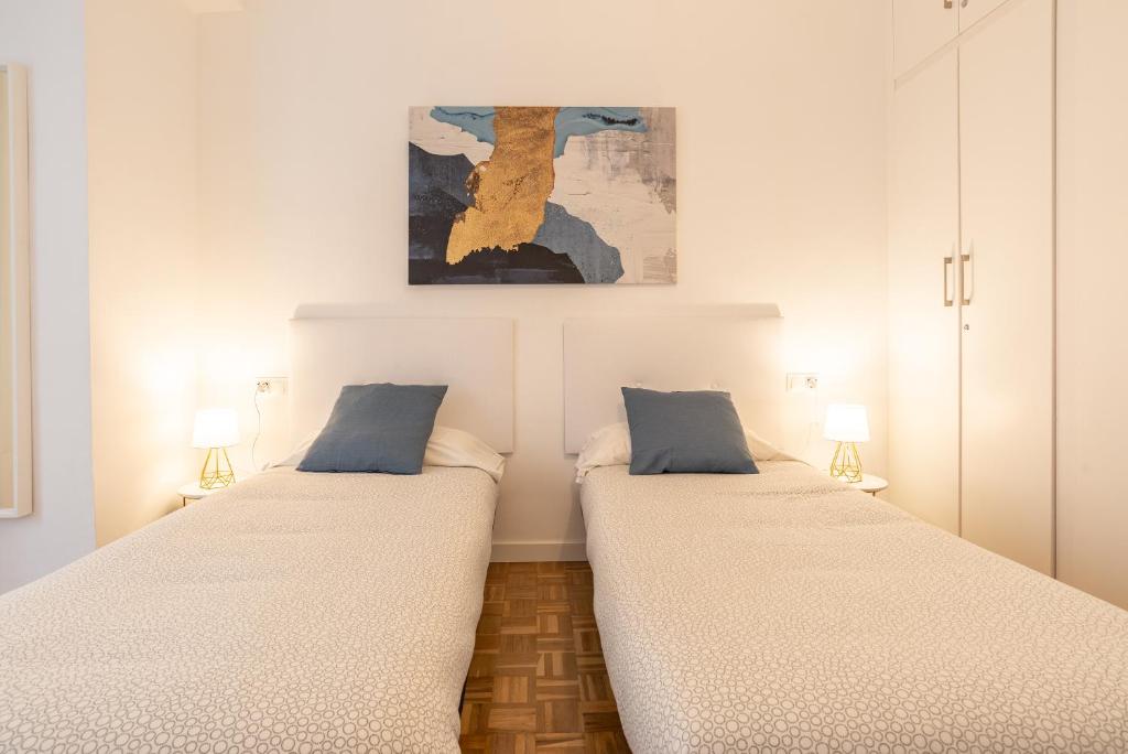 Postel nebo postele na pokoji v ubytování LUANDCIA Soho 3