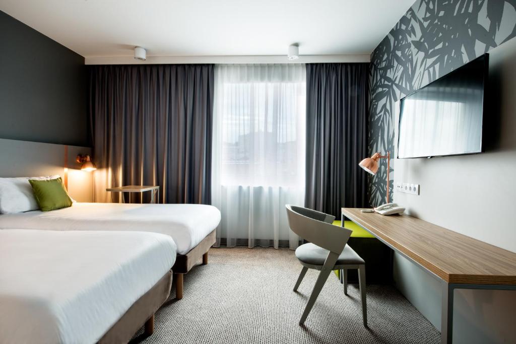 Posteľ alebo postele v izbe v ubytovaní ibis Styles Siedlce