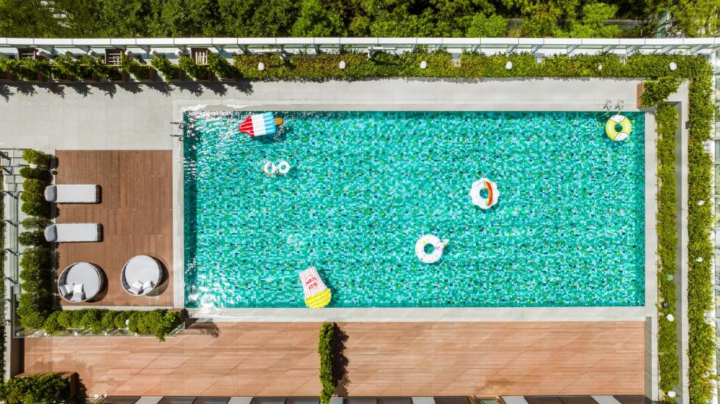 an overhead view of a swimming pool with inflatables at Hyatt Place New Taipei City Xinzhuang in Xinzhuang