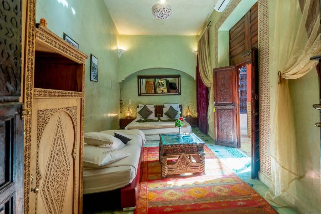 Postel nebo postele na pokoji v ubytování Riad Rêves D'orient & Spa