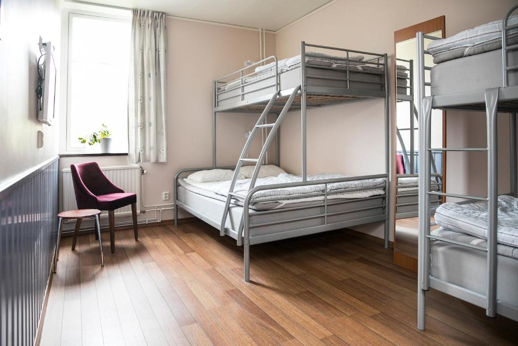Postel nebo postele na pokoji v ubytování Kvibergs Vandrarhem - Hostel