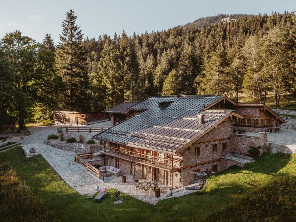 an aerial view of a house with a roof at Die Suttenhütte - Chalet 1034 m über dem Alltag in Rottach-Egern