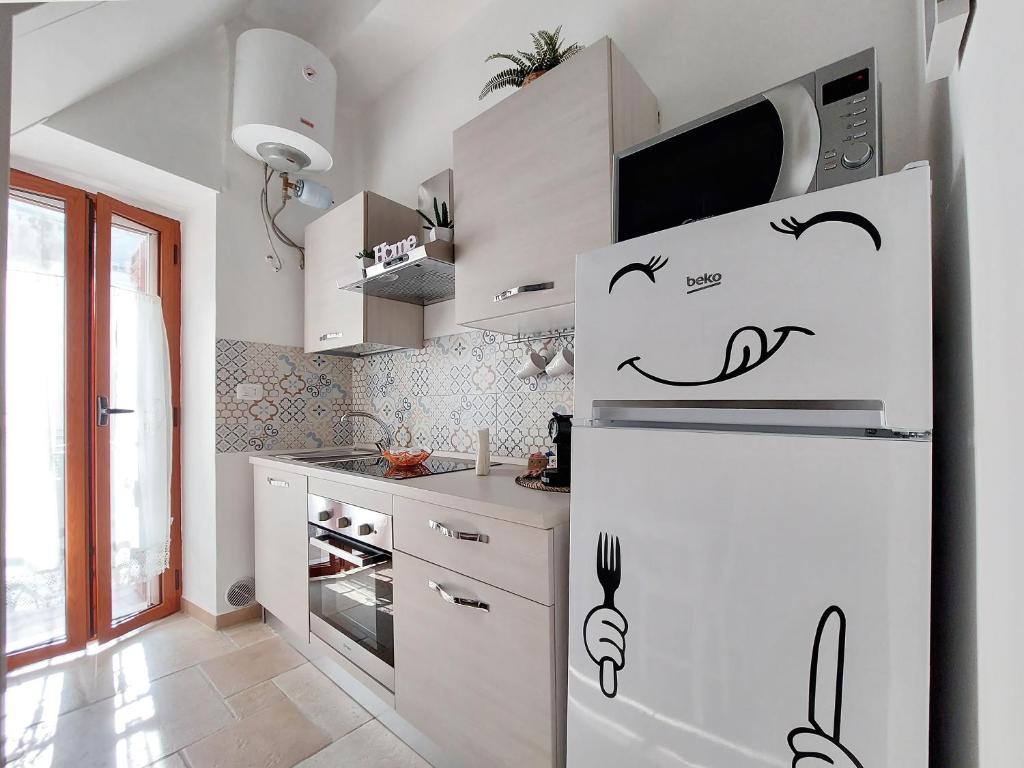 Kuchyň nebo kuchyňský kout v ubytování Casa vacanze LaCorte ByFrancy