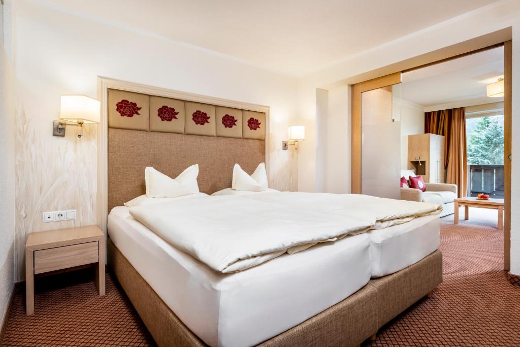 Postel nebo postele na pokoji v ubytování Hotel Rita