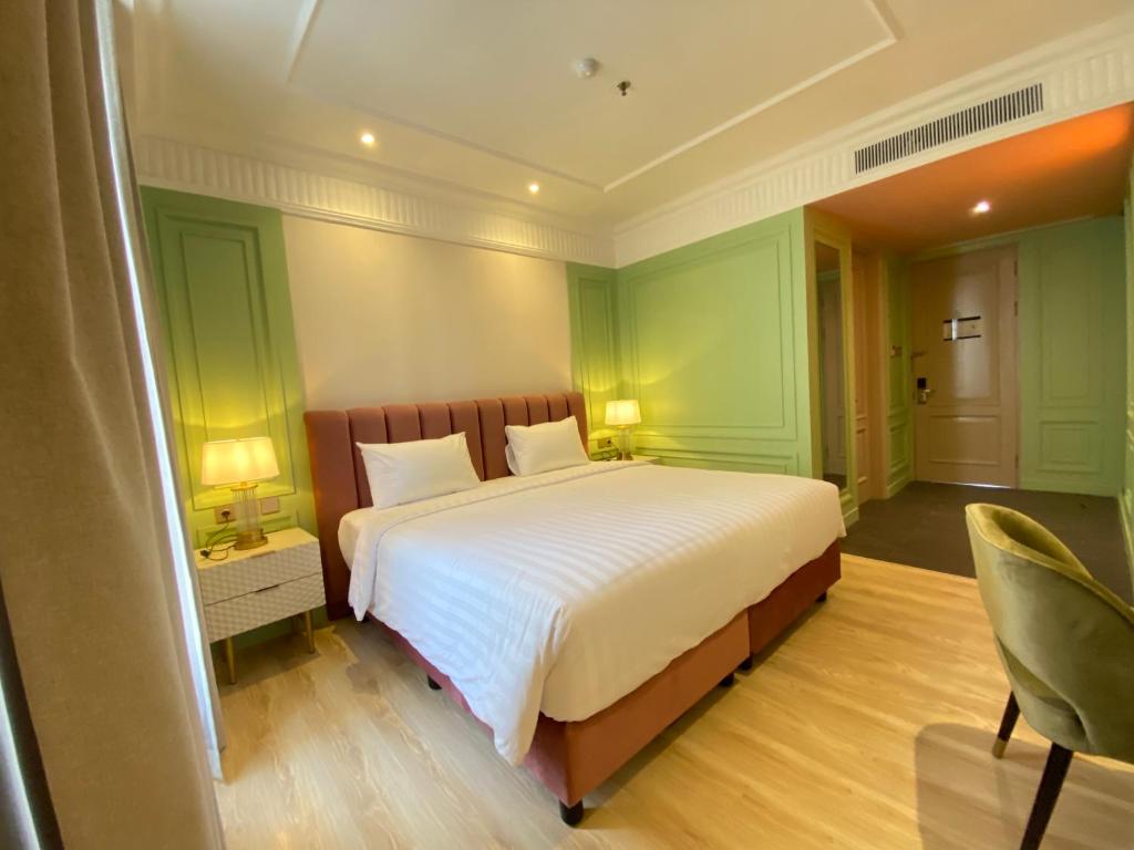 Postel nebo postele na pokoji v ubytování Maia Hotel Jakarta
