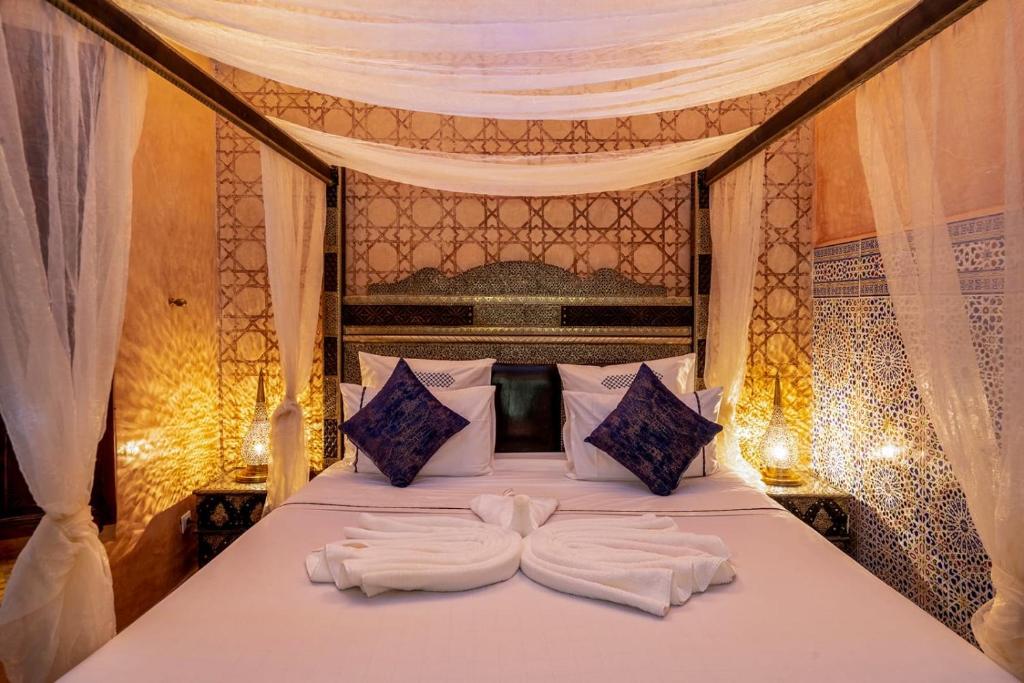 Postel nebo postele na pokoji v ubytování Riad Rêves D'orient & Spa