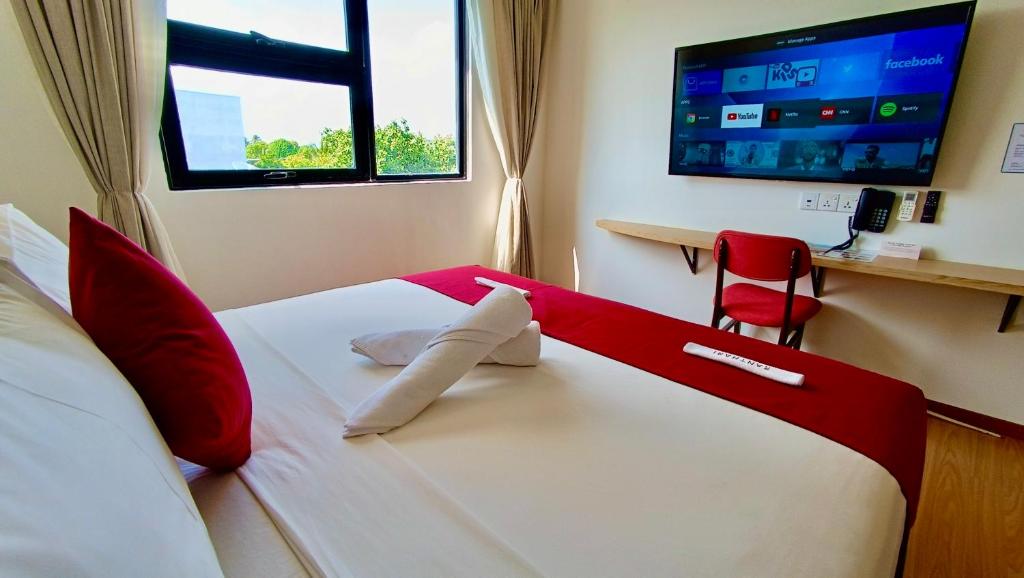 Postel nebo postele na pokoji v ubytování Ranthari Hotel and Spa Ukulhas Maldives