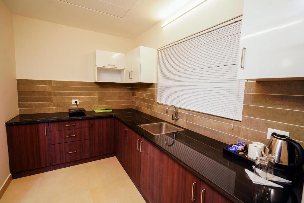 Kuchyň nebo kuchyňský kout v ubytování Lantern Apart Hotel