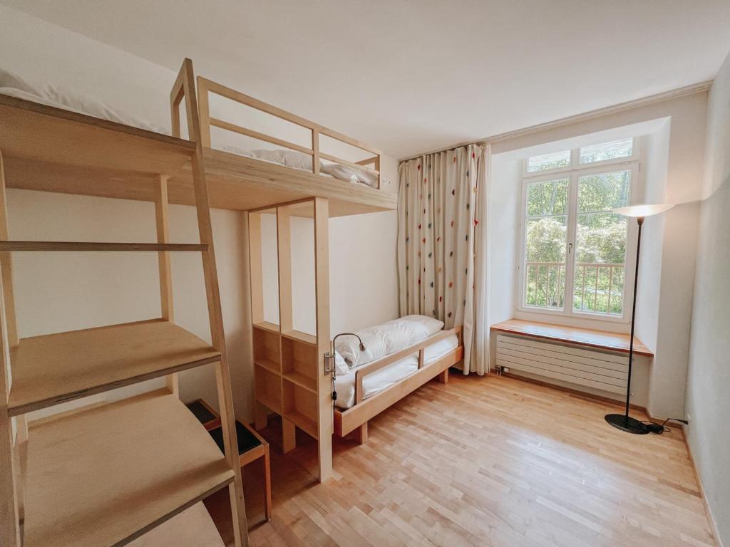 Postel nebo postele na pokoji v ubytování Schloss Wartegg