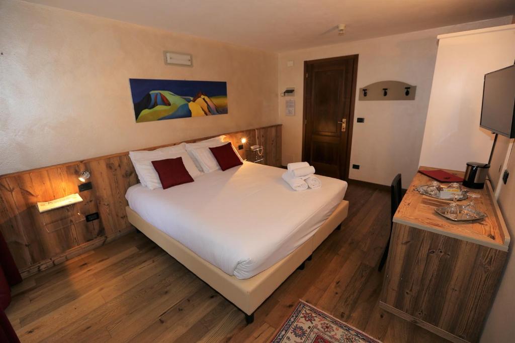 Postel nebo postele na pokoji v ubytování Hotel & Restaurant Le Charaban