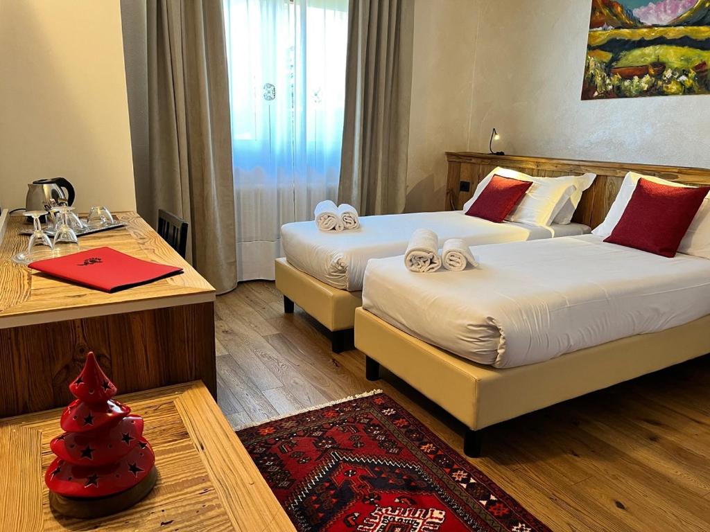 Postel nebo postele na pokoji v ubytování Hotel & Restaurant Le Charaban