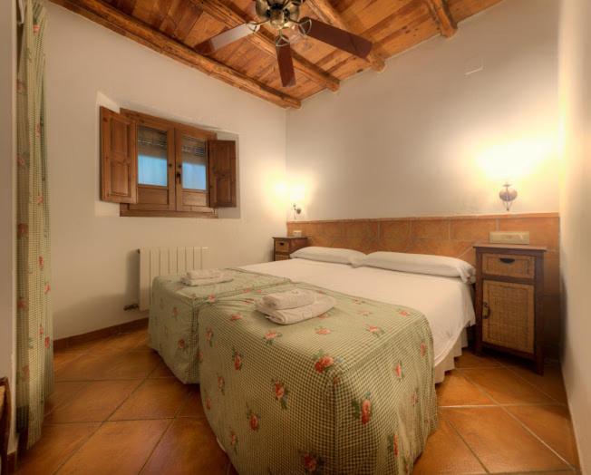 Cama o camas de una habitación en Cortijo Balzain