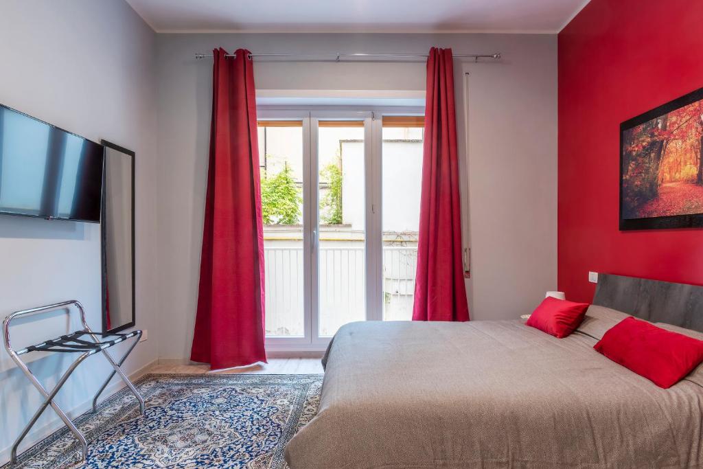 A bed or beds in a room at Clodia Apartments