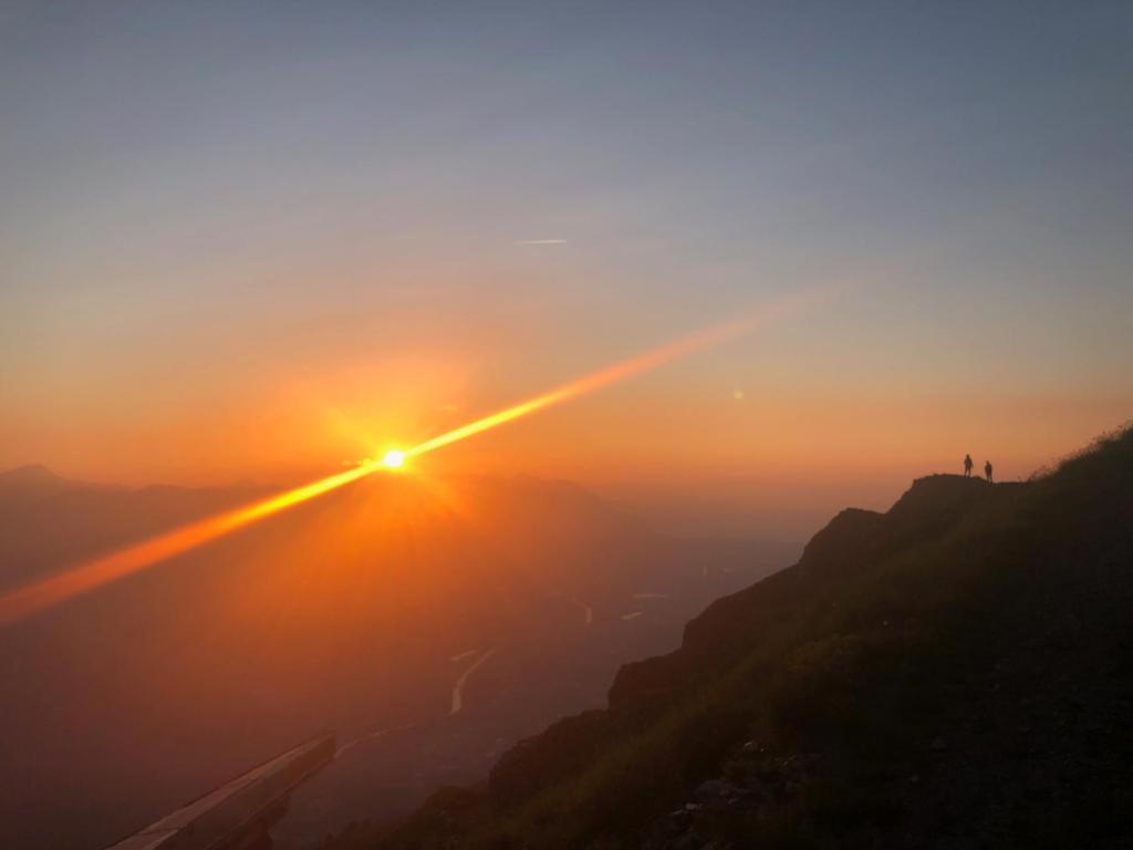 a view of the sunset from the top of a mountain at Chalet Ingas in Troistorrents