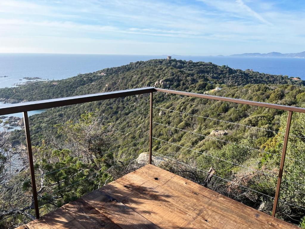 a view of a hill with the ocean in the background at Domaine de la coletta Maison traditionnelle in Coti-Chiavari