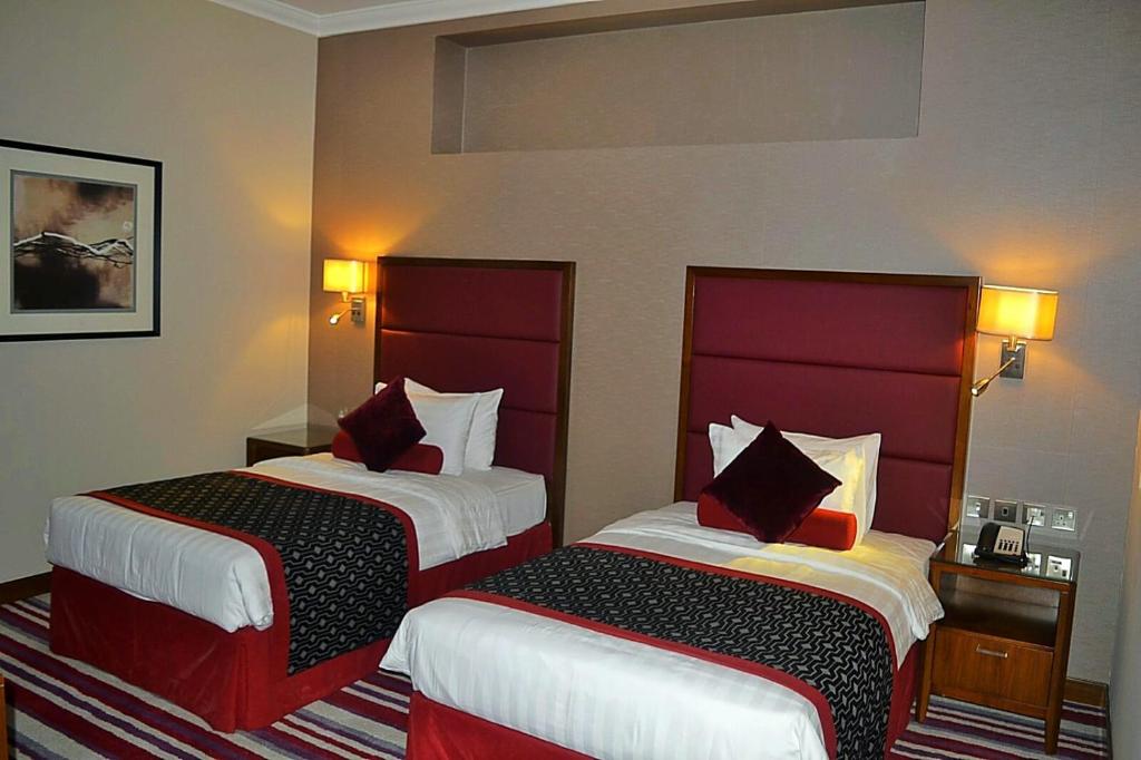 Postel nebo postele na pokoji v ubytování Wonder Palace Hotel Qatar