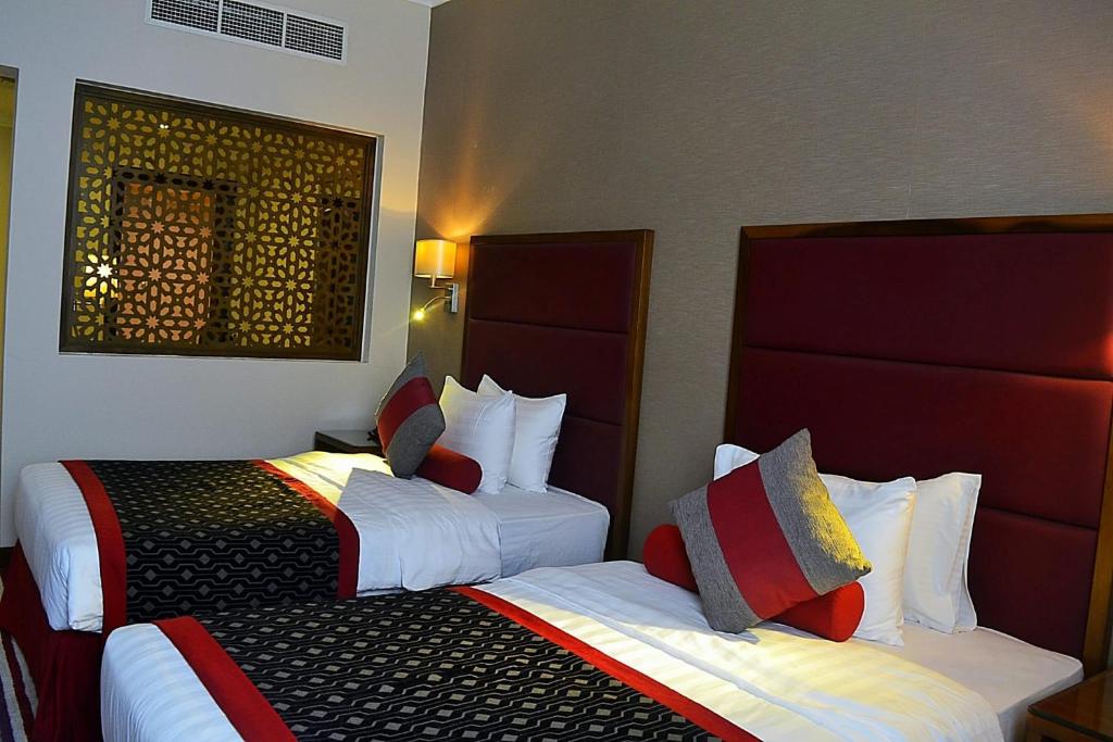 Postel nebo postele na pokoji v ubytování Wonder Palace Hotel Qatar