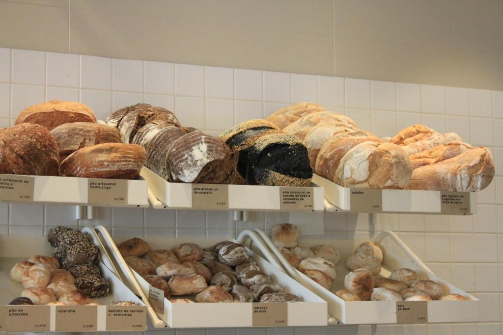 a display of different types of breads and pastries at RM The Experience - Small Portuguese Hotels in Setúbal