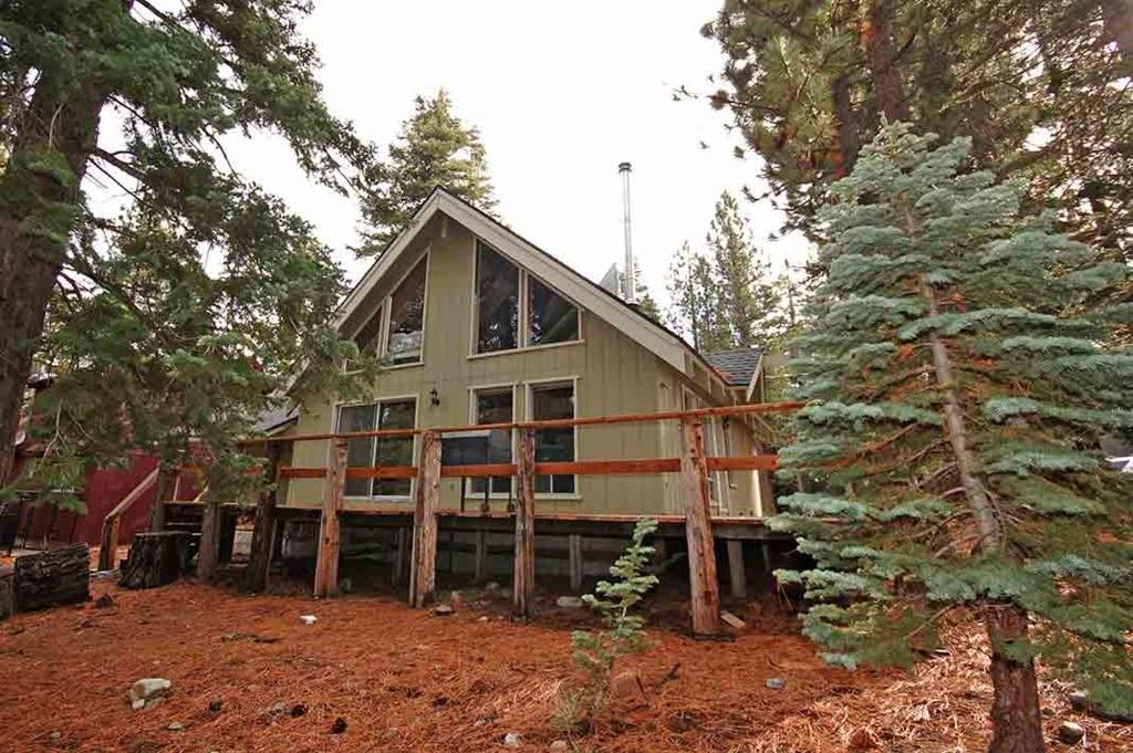 a large house in the middle of a forest at 0665 Yucatan in South Lake Tahoe