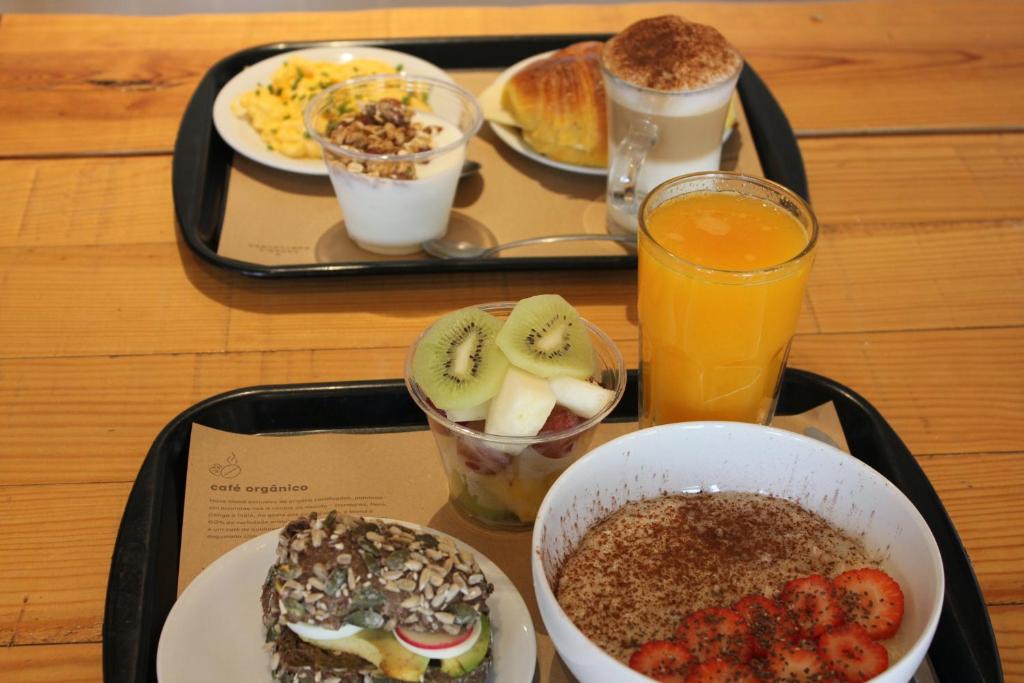 a tray with a tray of breakfast foods and drinks at RM The Experience - Small Portuguese Hotels in Setúbal
