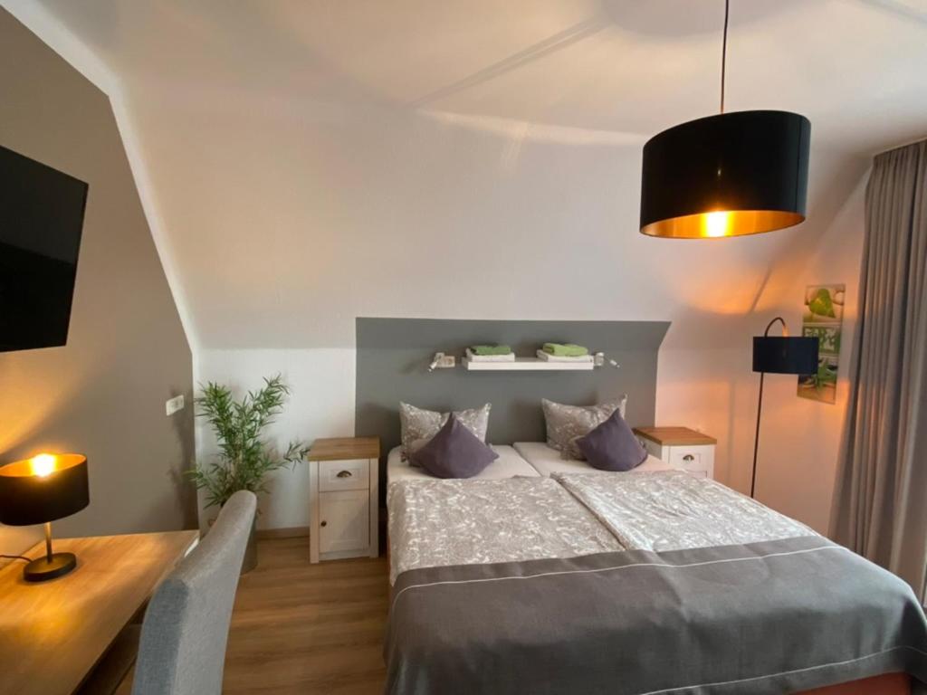 Postel nebo postele na pokoji v ubytování Wilsmann Apartmentvermietung