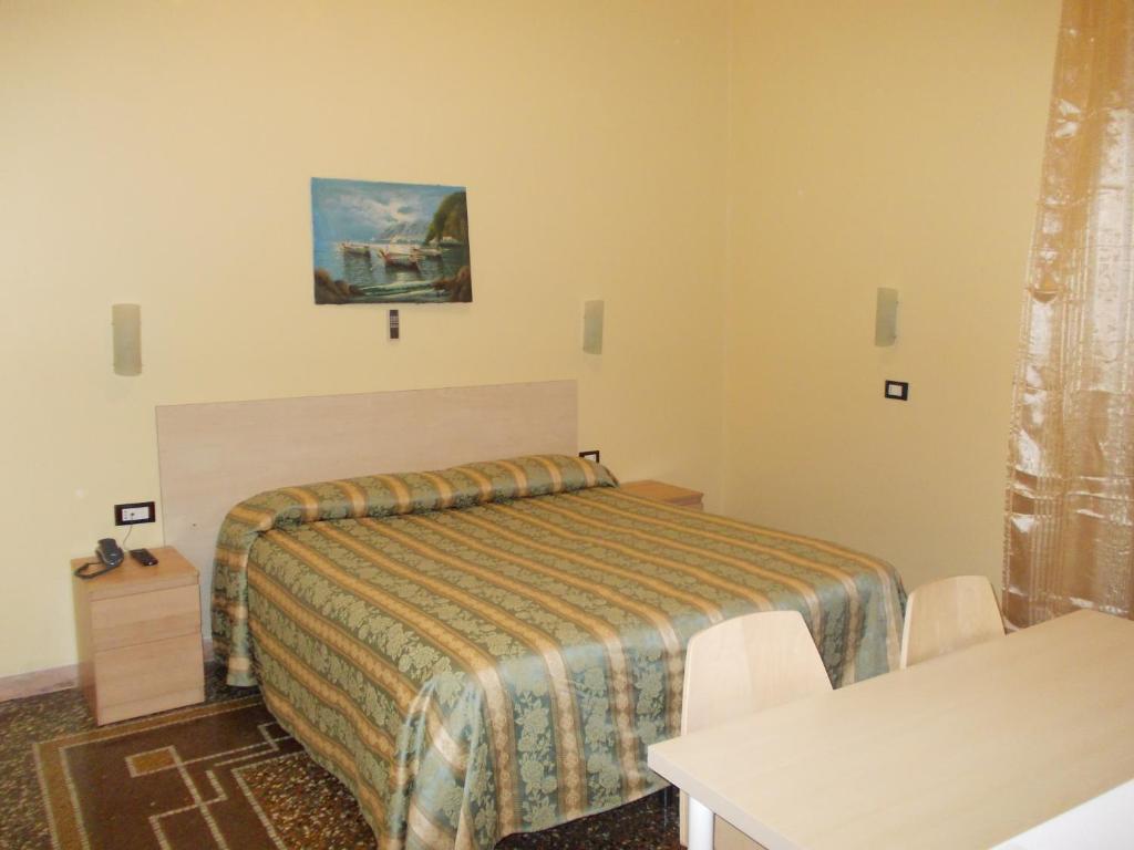 Postel nebo postele na pokoji v ubytování Albergo Boccadasse