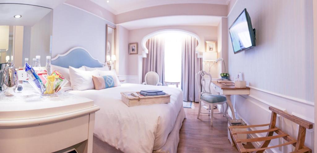 TV a/nebo společenská místnost v ubytování Noor Hotel