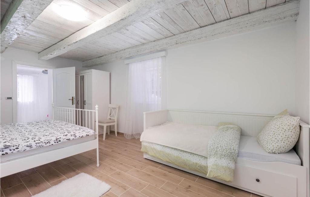 Posteľ alebo postele v izbe v ubytovaní Nice Home In Otocac With Sauna
