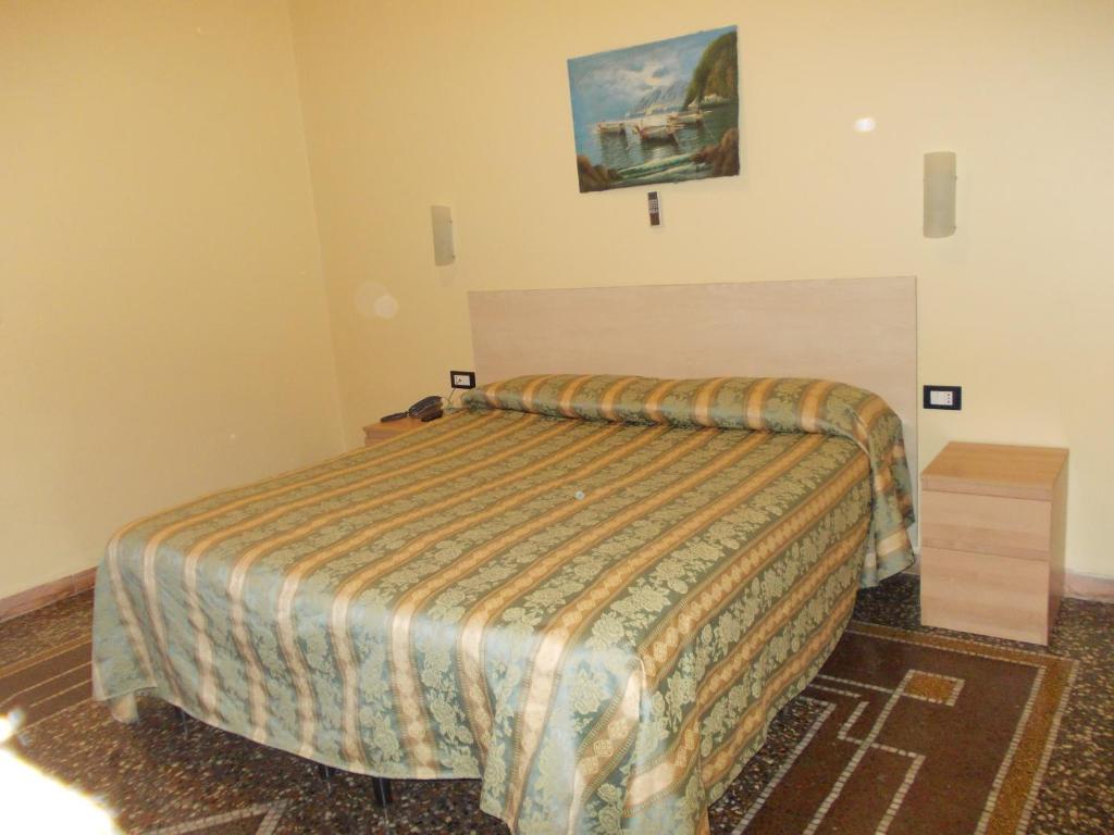 Postel nebo postele na pokoji v ubytování Albergo Boccadasse