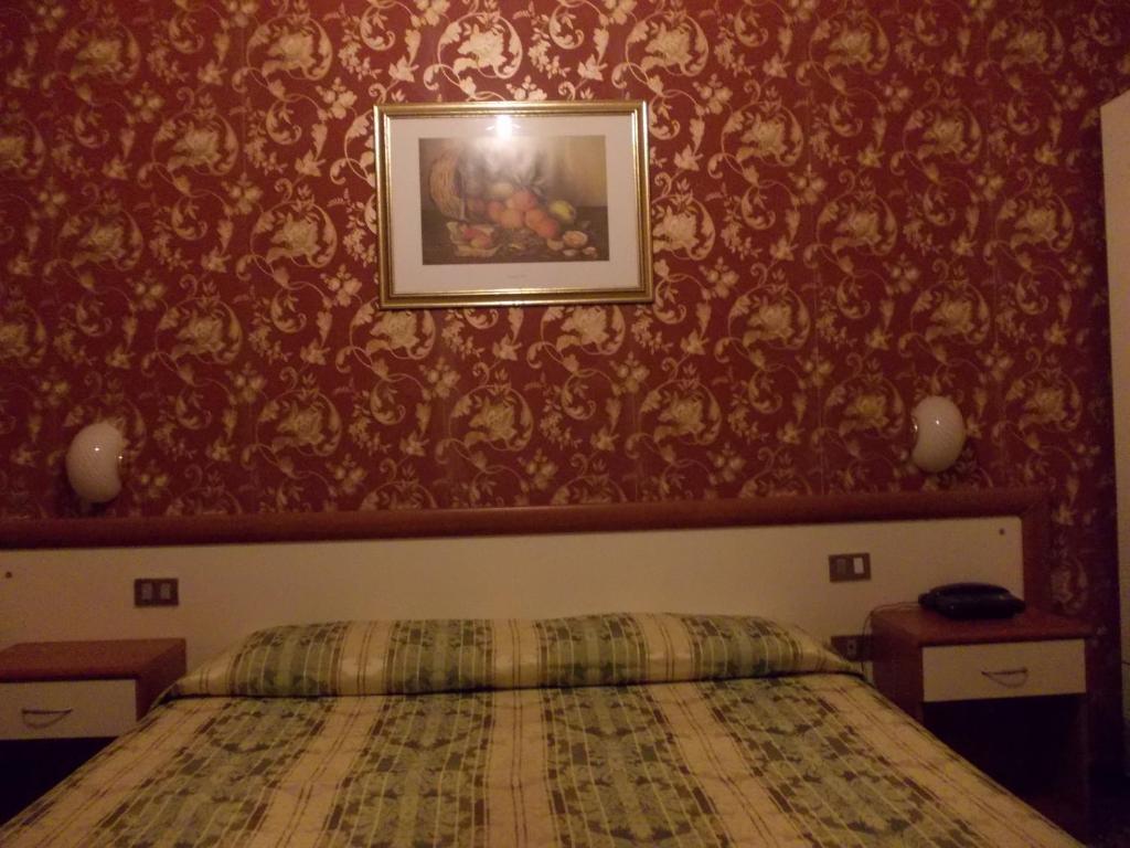 Postel nebo postele na pokoji v ubytování Albergo Boccadasse